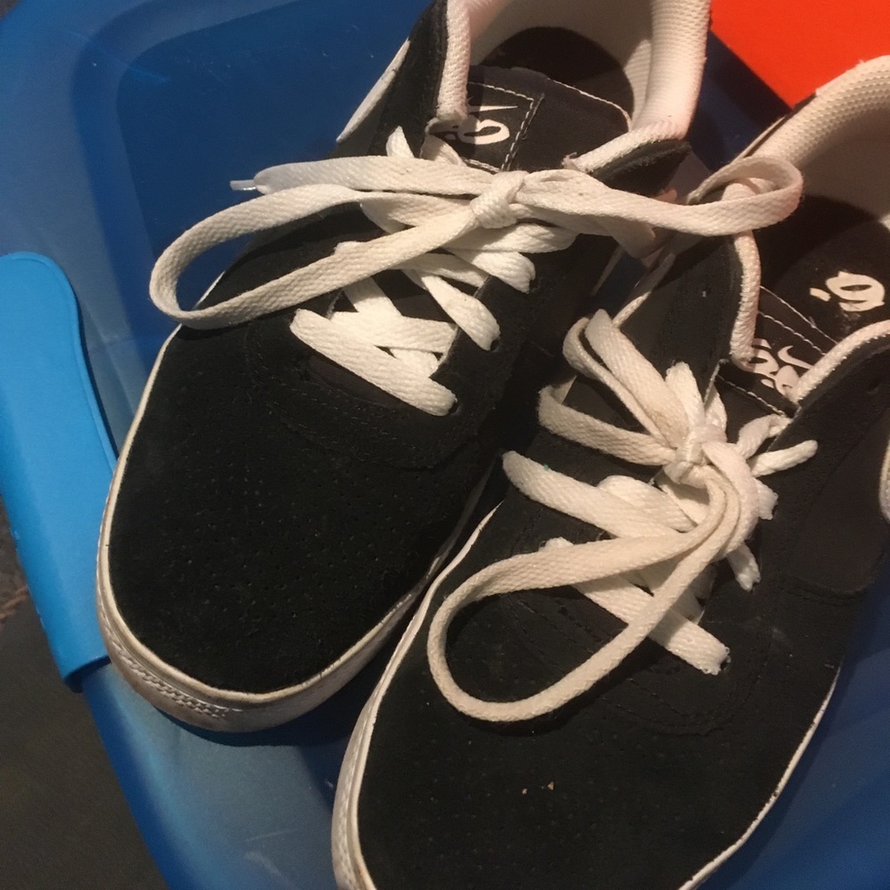 Black & white suede Nike shoes.
