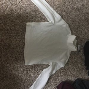 Brand new white, long sleeved, cropped turtleneck