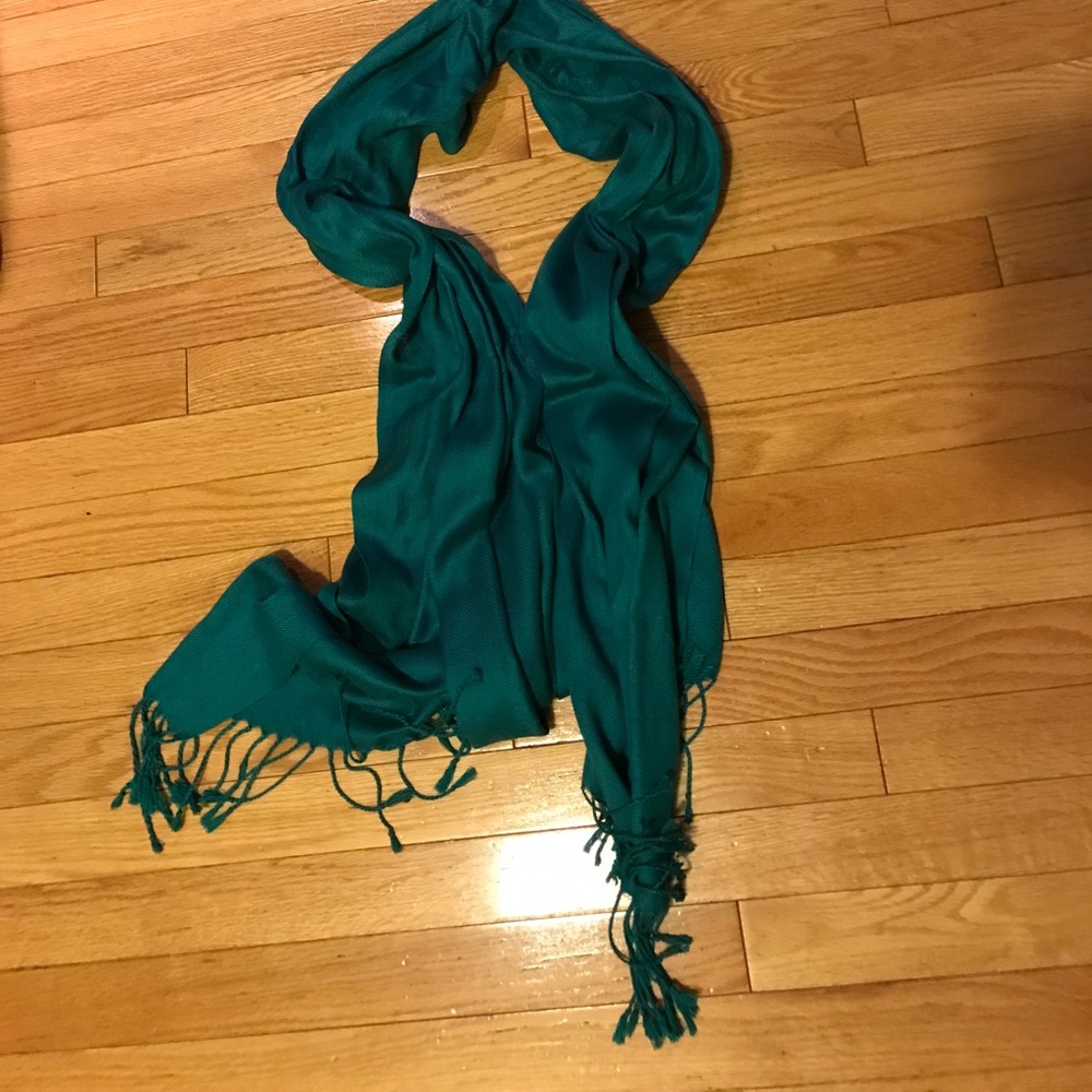 Long soft teal scarf.