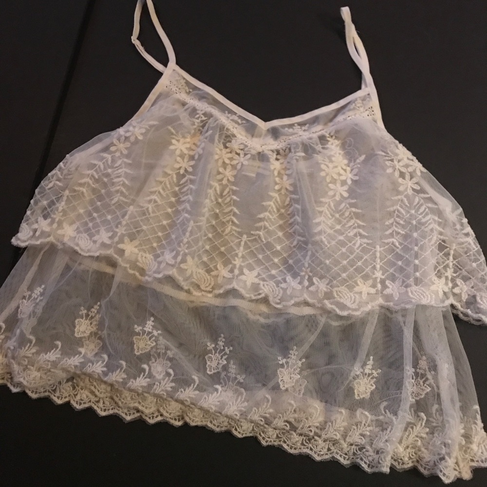 Sheer ivory lace tank top with embroidered details