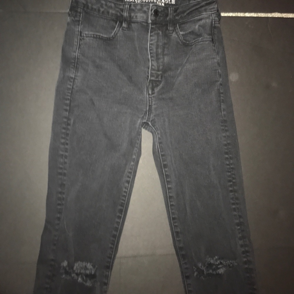 Black high rise skinny jeans with slits in knees