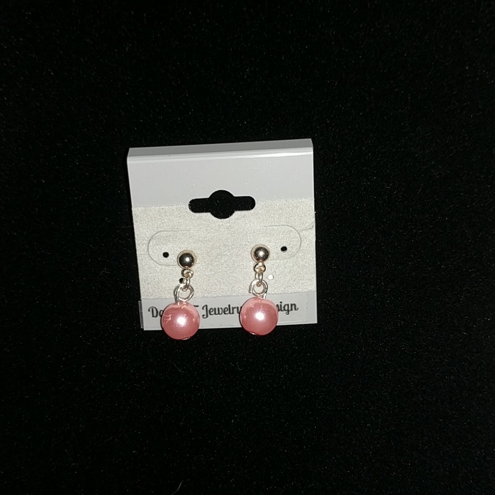 Pink pearl earrings on silver stud