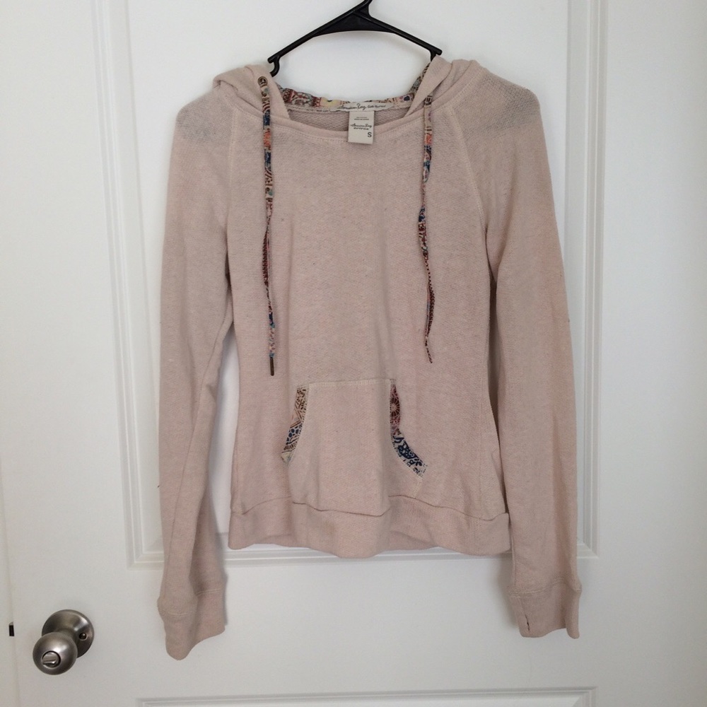 Tan sweatshirt with design in hood!