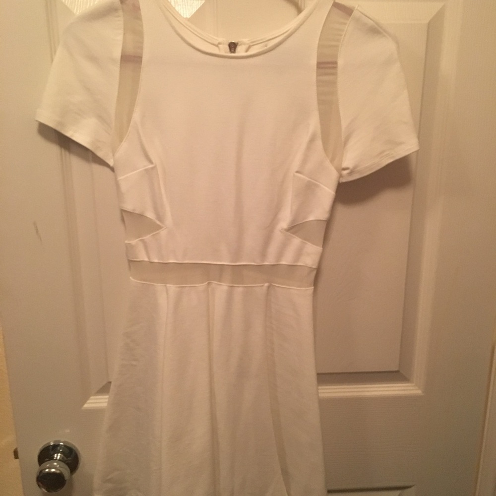 White fitted flare dress with mesh cut outs