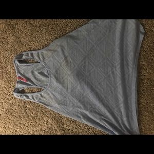 See through periwinkle cut out back tank.