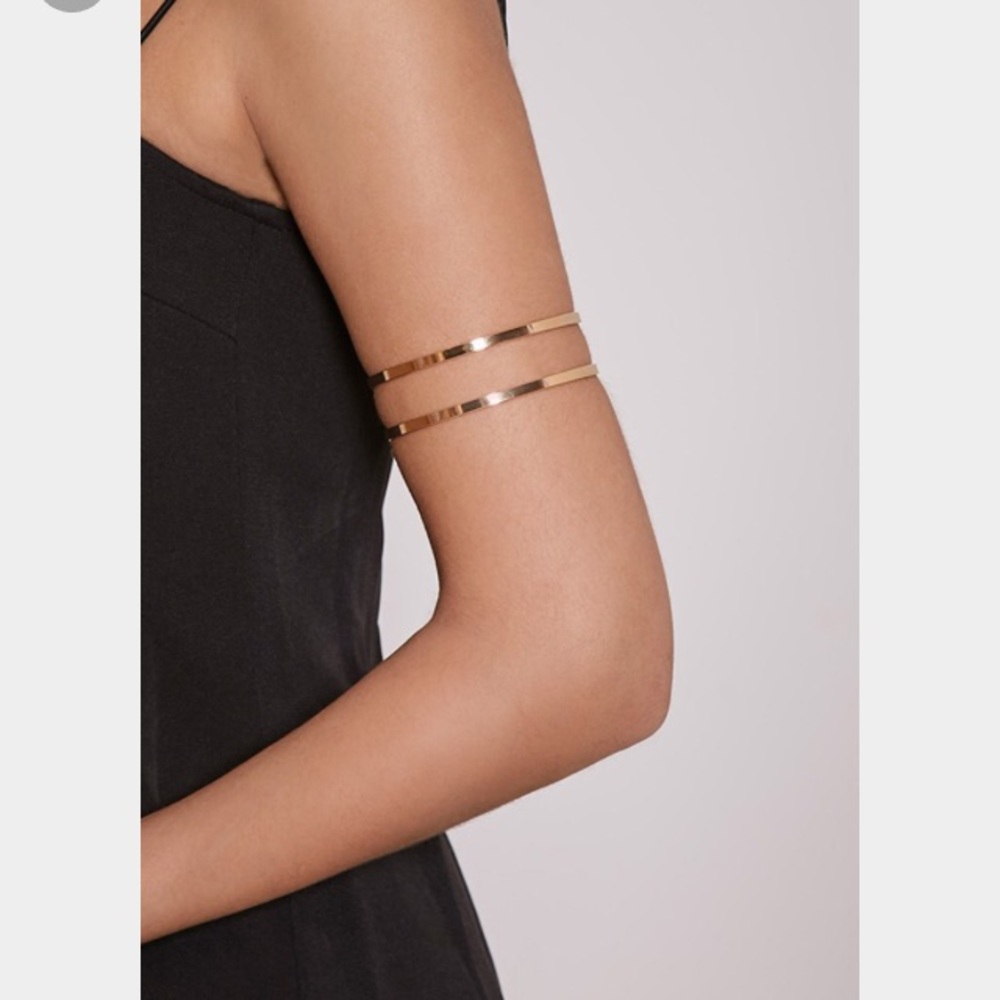 Gold swirl arm bracelet