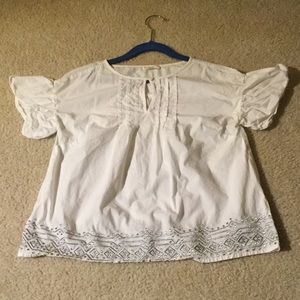 A white J. Crew blouse.