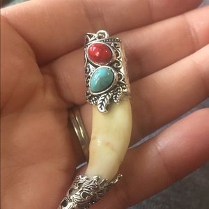 Real turquoise silver capped wolf tooth pendant.