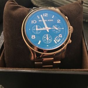 Michael Kors rose gold watch with blue face