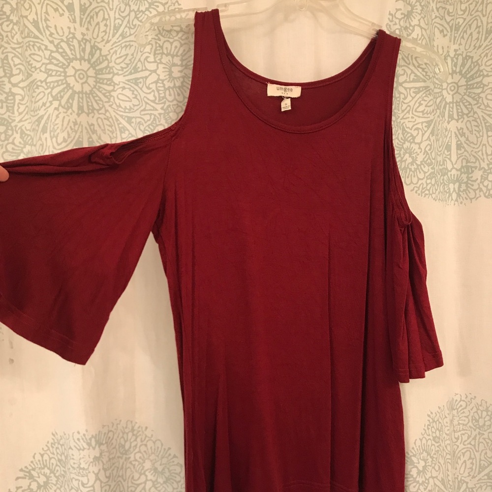 Red, flowy cold shoulder top.