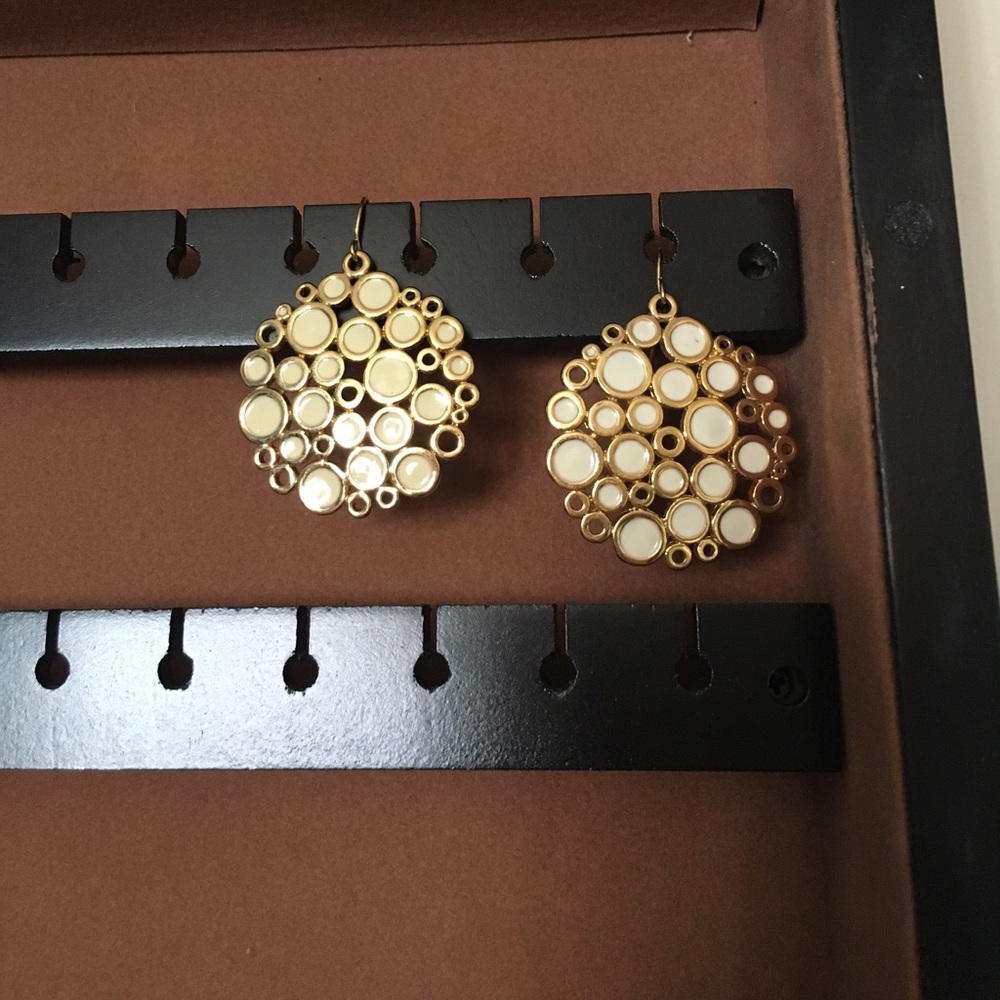 Gold and cream earrings