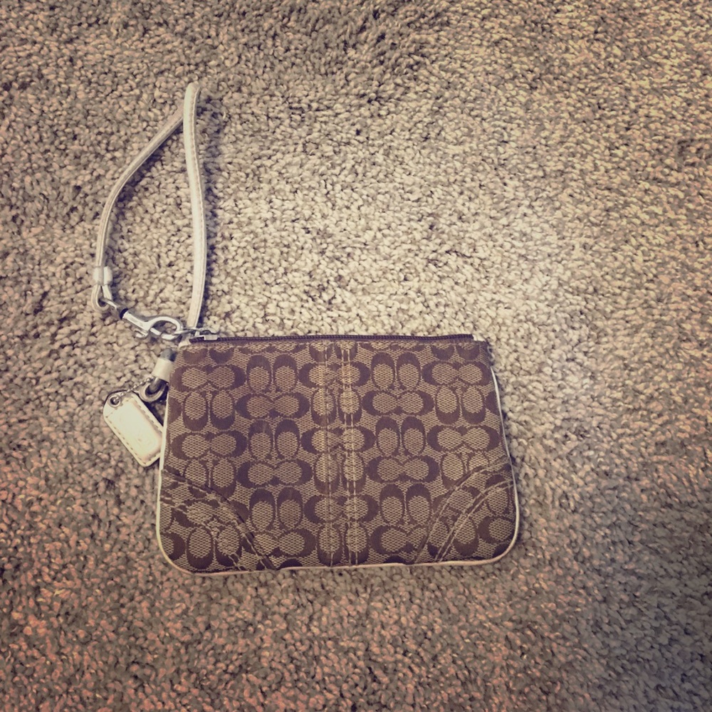 Brown small wristlet with white strap