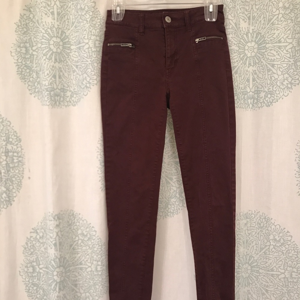 Maroon American Eagle jeans with zipper details