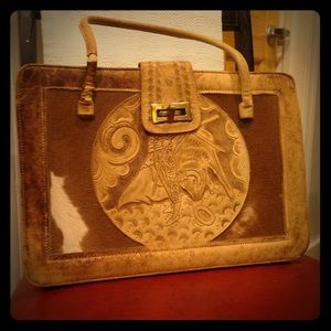 Busted leather carved cowhide purse