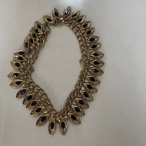 Apostrophé black and gold necklace.