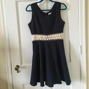 Navy blue dress with white lace trim