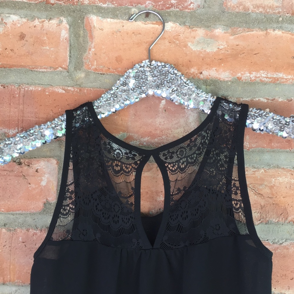 Sheer black lace top with ruffle front and lace