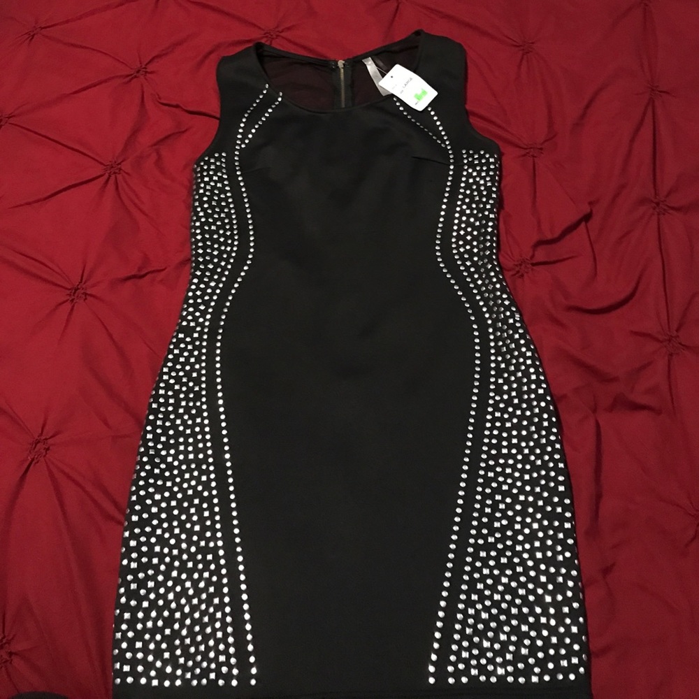 Black dress very flattering new with tags