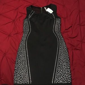 Black dress very flattering new with tags