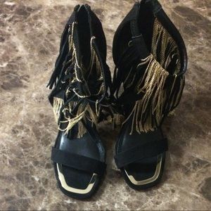 Black Suede Express Gold Chains And Fringed Heels