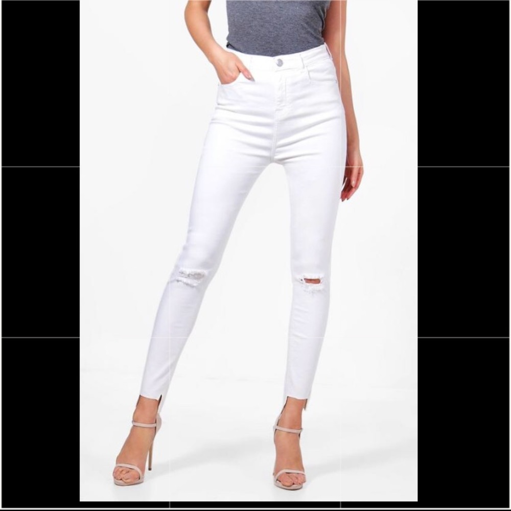 High rise slit knee step hem skinny jeans