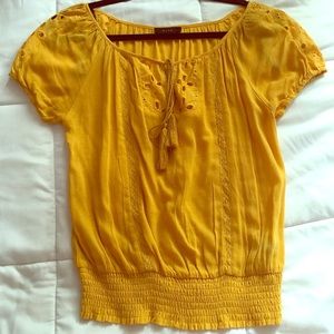 A lightweight yellowish gold shirt 💛