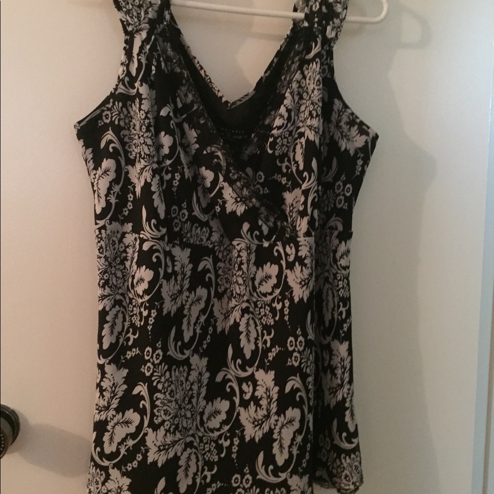 Black and white sleeveless top with lace at bottom