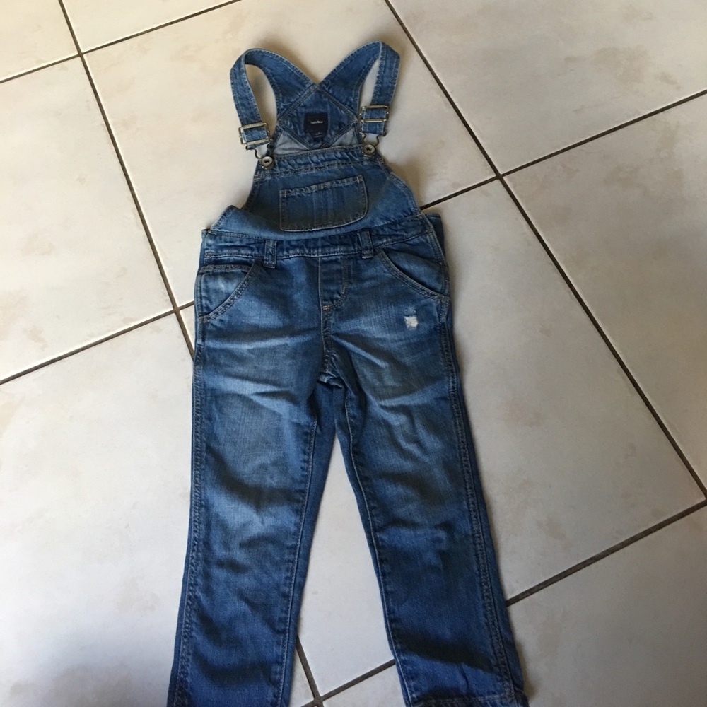 Distressed denim overalls