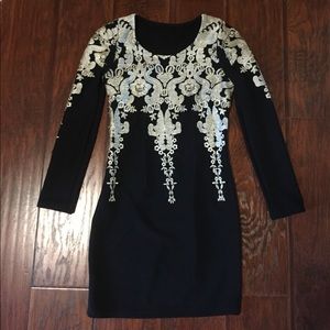 Black fitted dress with light gold detailing