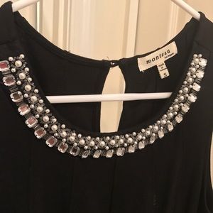 Monteau dress with folds at the end.