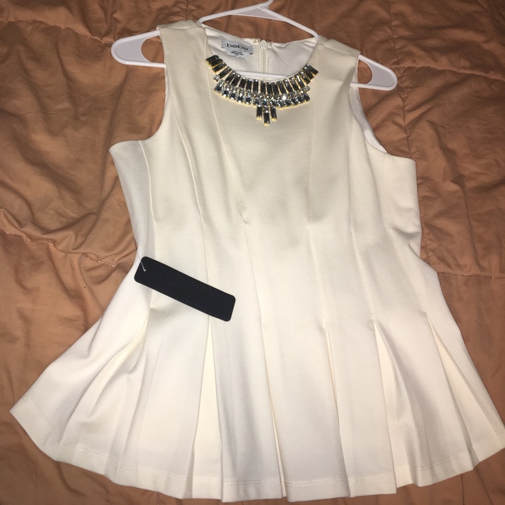Bebe cream embellished loose peplum top NEW