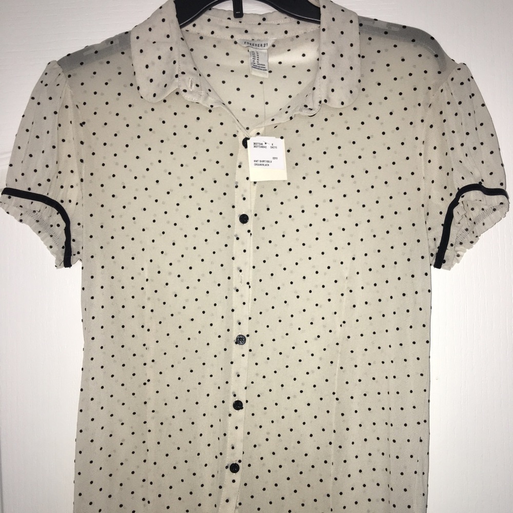 White and black polka dot button up shirt