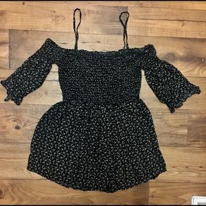 Black romper with white rose pattern