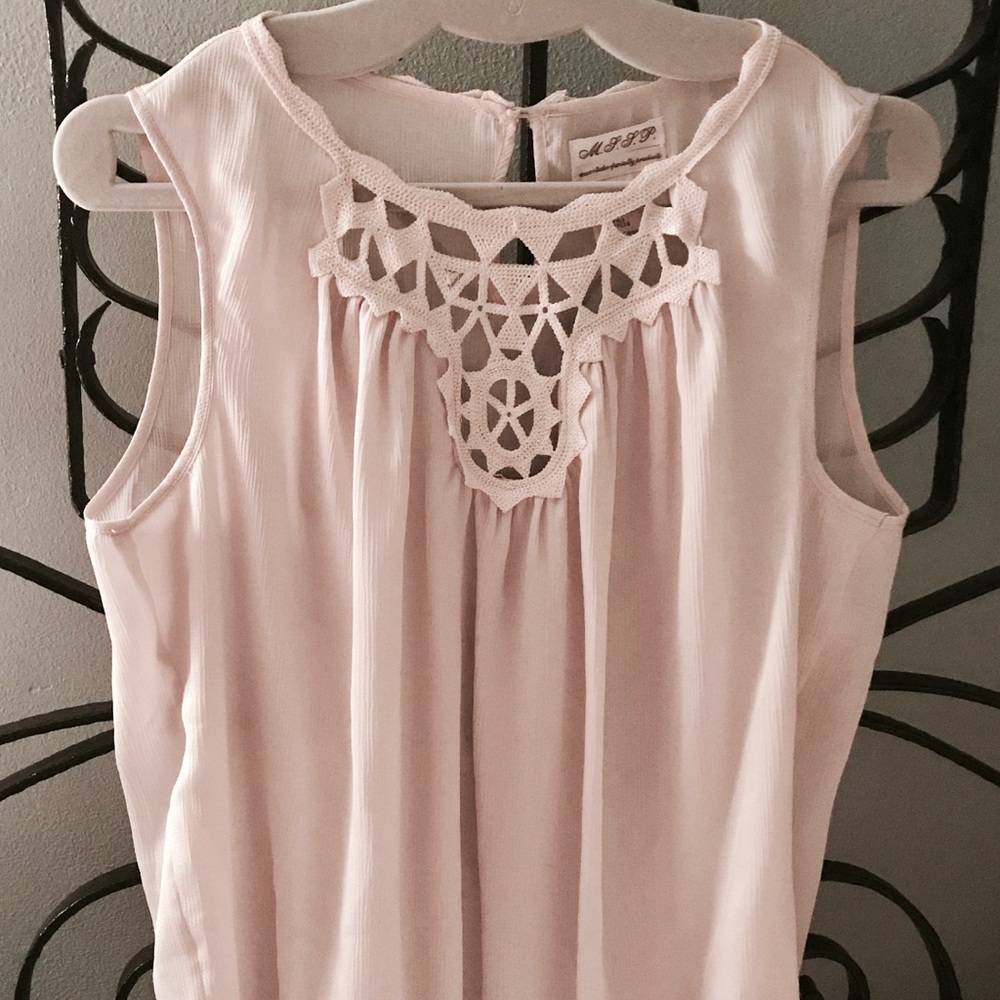 M. L. L. P. SLEEVELESS BLOUSE W EMBELLISHMENTS.