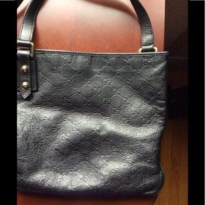 Gucci leather messenger bag.