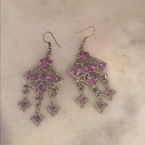Silver earrings with amethyst stones.