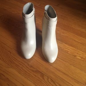 Never worn heeled boots. Very cute with jeans.