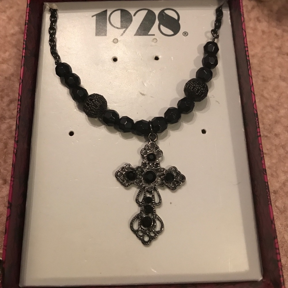 Silver and black beaded cross