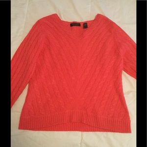 Coral pink cashmere sweater.