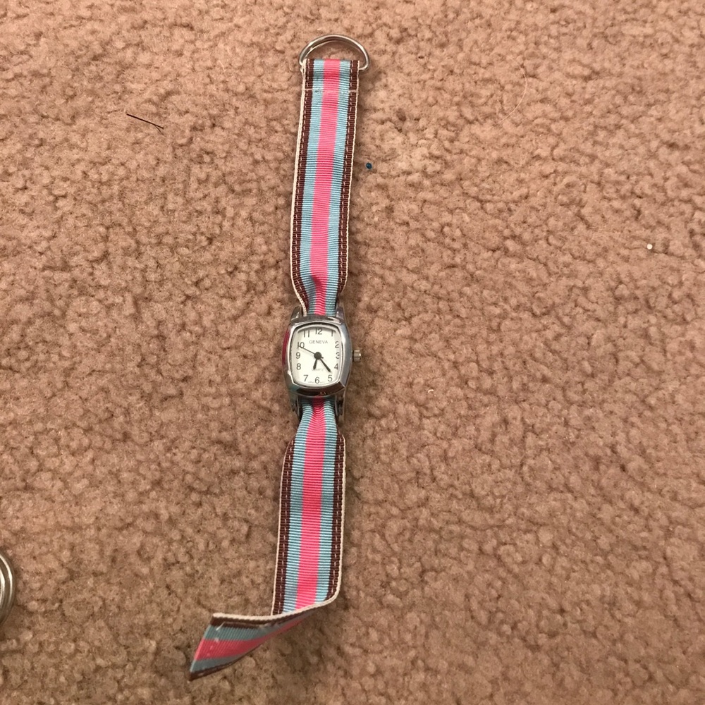 Geneva watch face with stripped removable band