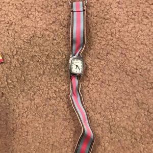 Geneva watch face with stripped removable band