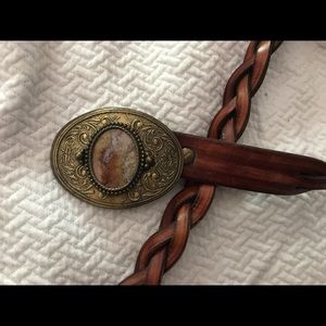 Genuine leather brown belt with stunning buckle.