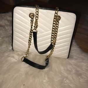 Black, white, and gold Bebe handbag