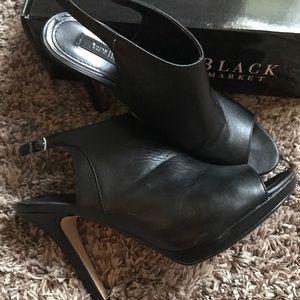 Sleek black peep toe ankle boots