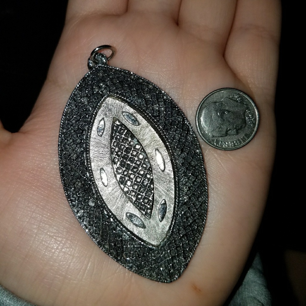 Antique silver charm