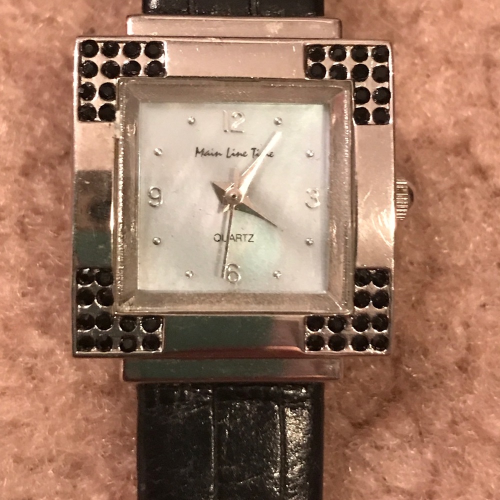 Stainless steel watch with genuine leather band