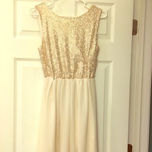 Cream, sparkly colored Charming Charlie dress.