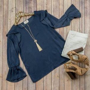 Slate navy blue satin blouse with ruffle accents
