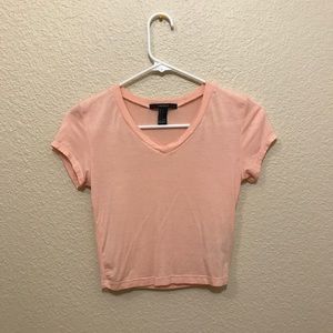 Light pink, v-neck crop top.