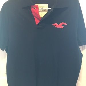 Hollister brand polo shirt, navy blue w/red bird